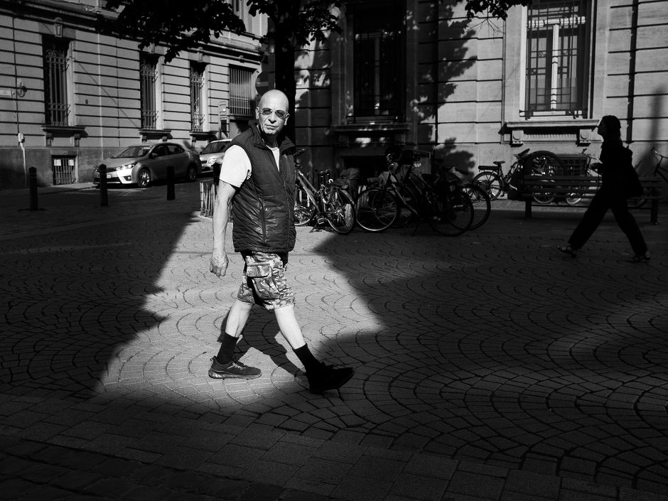 Black & white photograph of a man in camouflage shorts